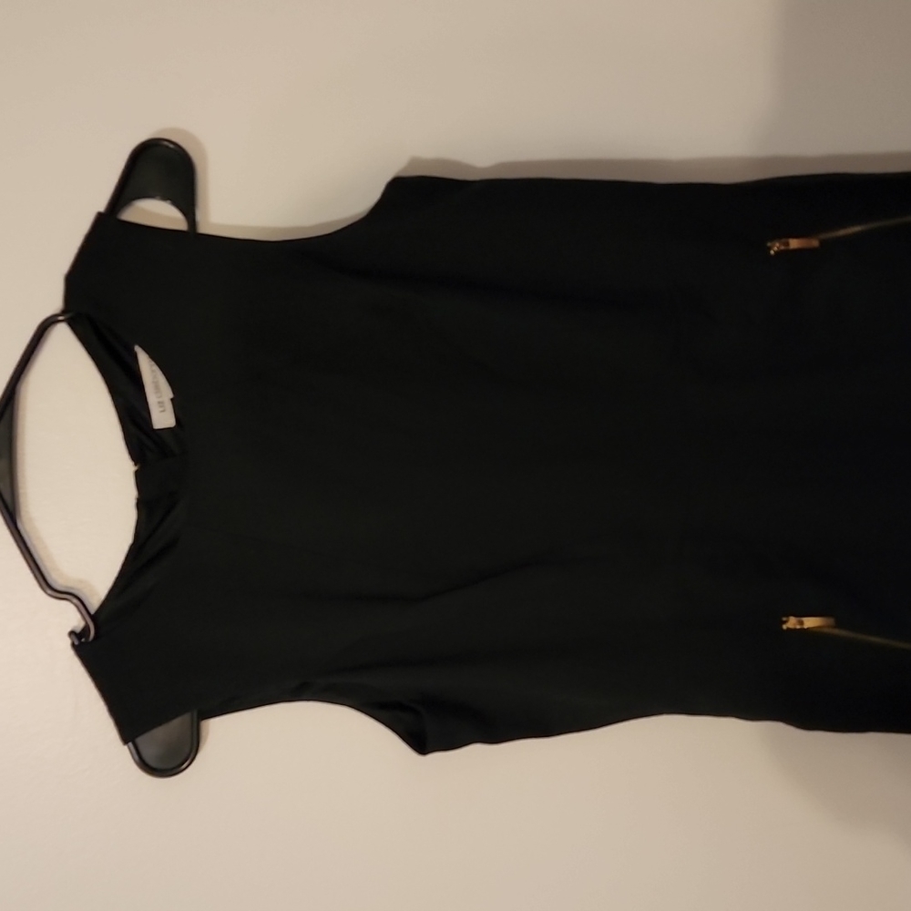 Perfect little black dress any occasion. Sleeveless with 2 gold zipper pockets